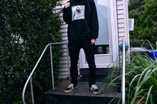 Load image into Gallery viewer, Man wearing a hoodie outside